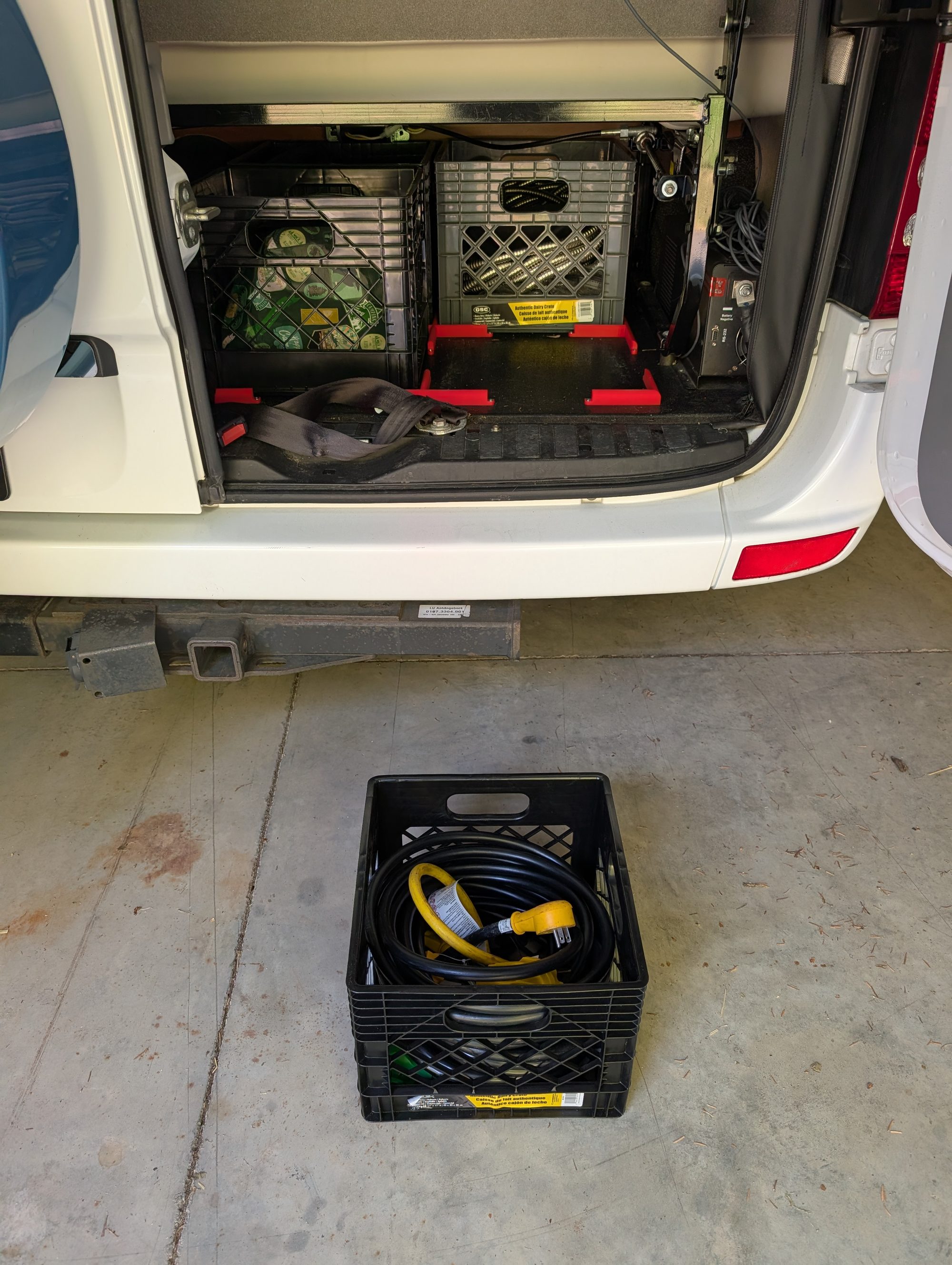 Rear storage compartment with shore power cord